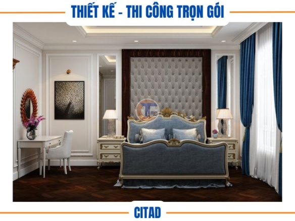 Phòng ngủ với đầu giường bọc da sang trọng và đèn bàn hai bên.