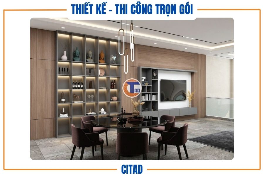 Bàn ăn tròn đặt giữa không gian bếp mở và phòng khách