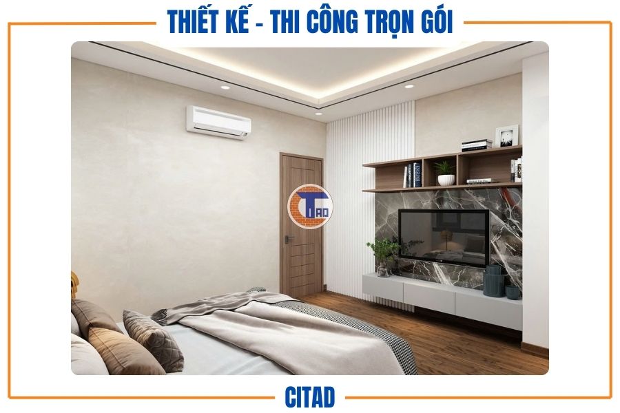 Phòng ngủ với kệ tivi âm tường và mảng ốp đá sang trọng