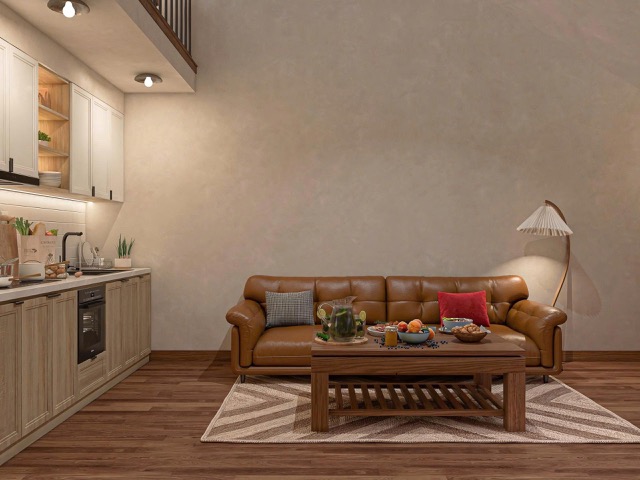 thiết kế phòng khách nhà gác lửng CITAD với sofa da nâu, bàn trà gỗ và ánh sáng vàng dịu