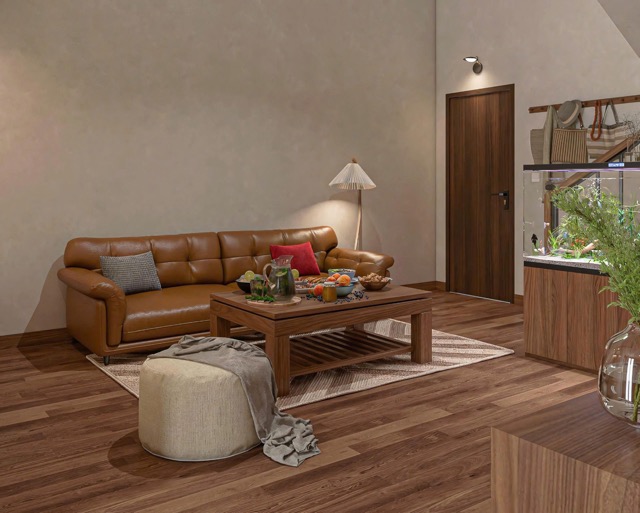 thiết kế phòng khách nhà gác lửng CITAD với sofa da nâu, bàn trà gỗ và ánh sáng vàng dịu